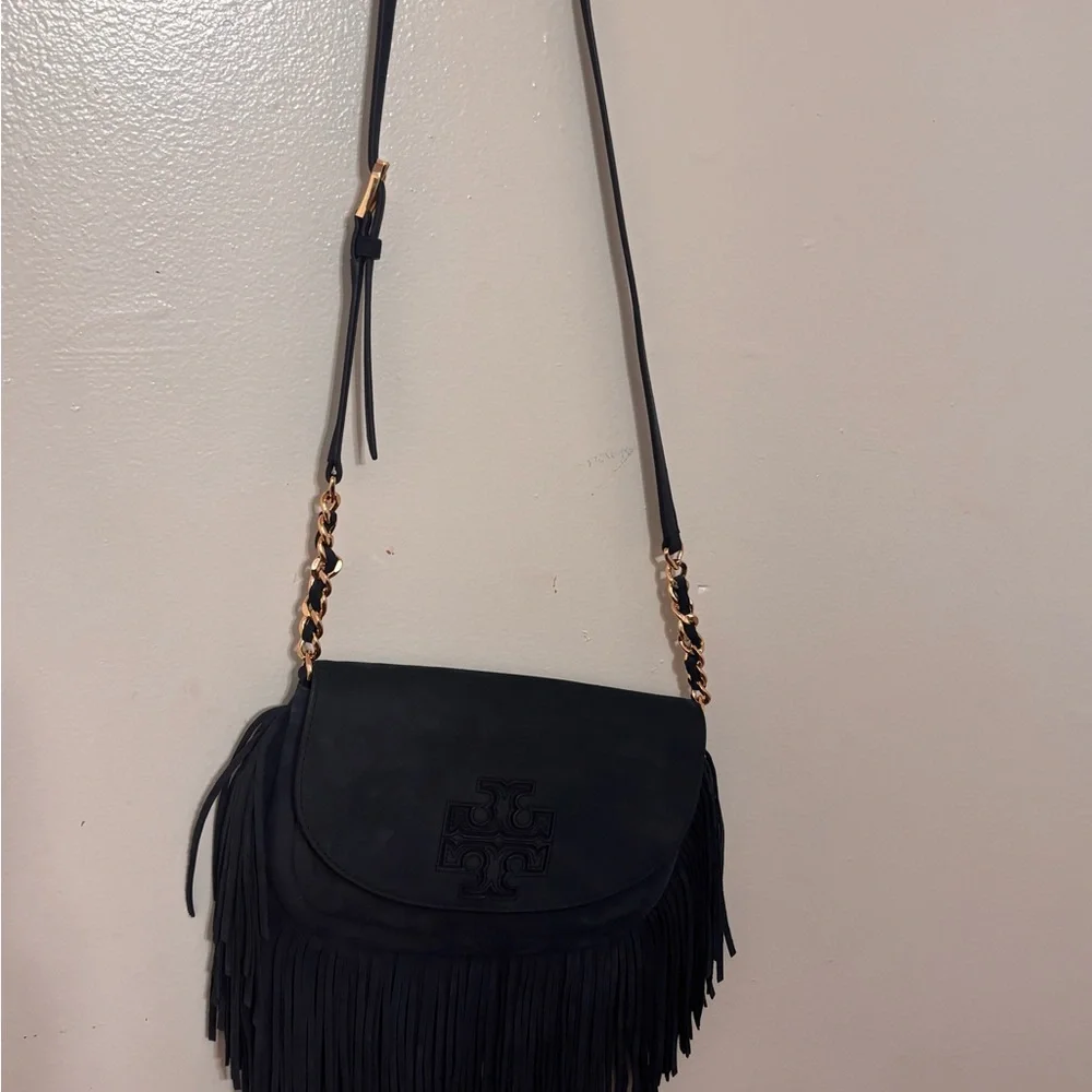 “Tory Burch Fleming Suede Fringe Crossbody Bag – Navy Blue”

• - Picture 7 of 10